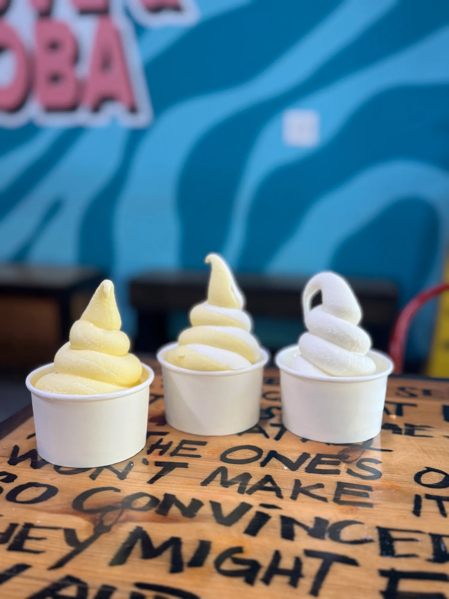 Vanilla, pineapple, and swirl soft serve cups